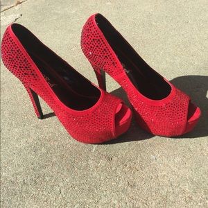 Red high heels embellished with crystals.